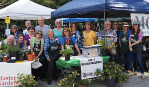 Extension Master Gardener Volunteers pose together for a picture after setting up the 2019 Plant Sale at Duke Gardens