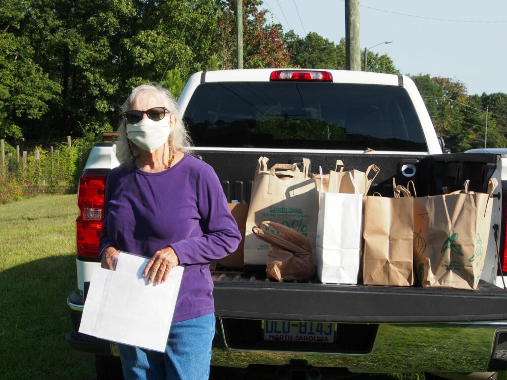 Volunteer with supplies in truck